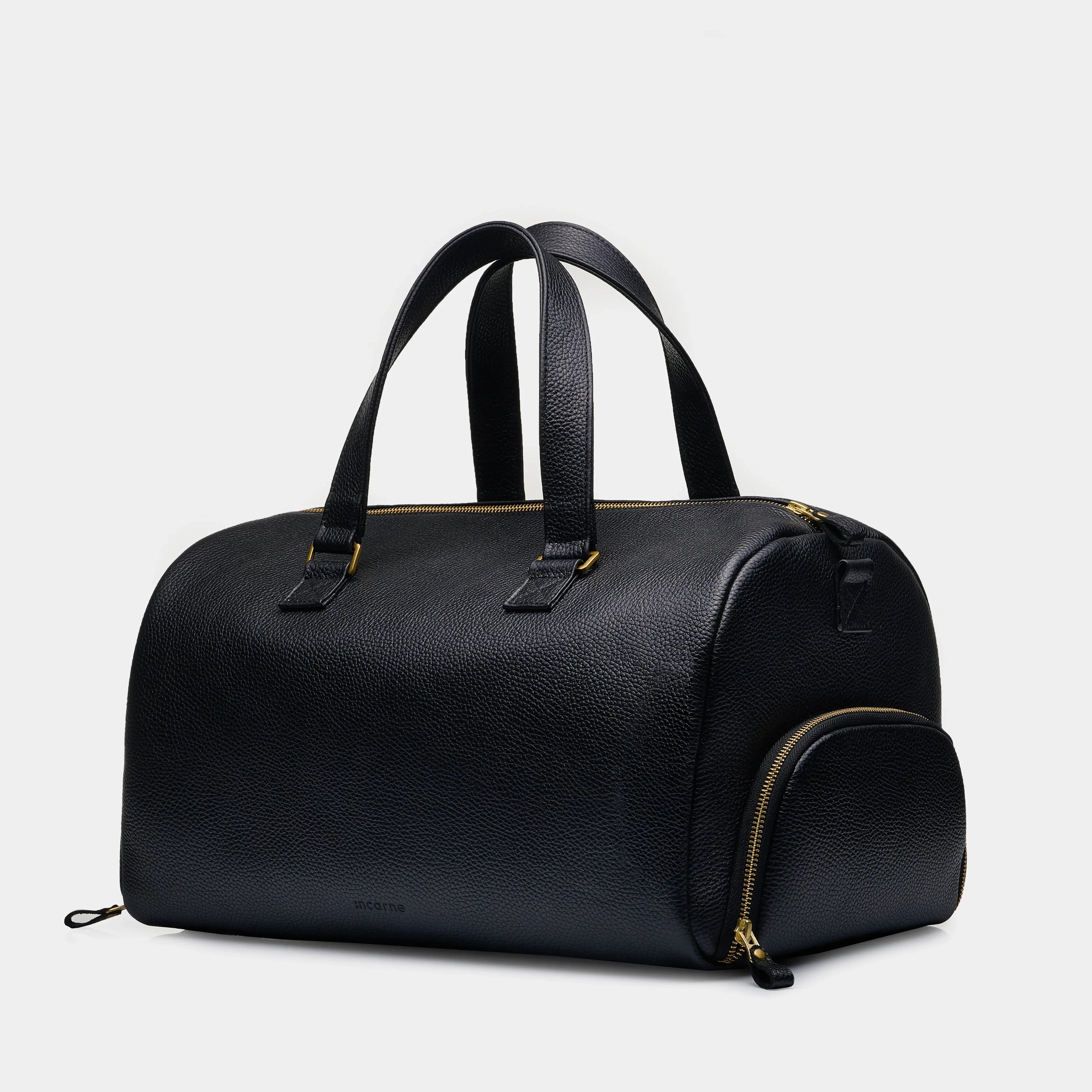 Open Nomad leather gym bag showing spacious main compartment and smooth metal zipper