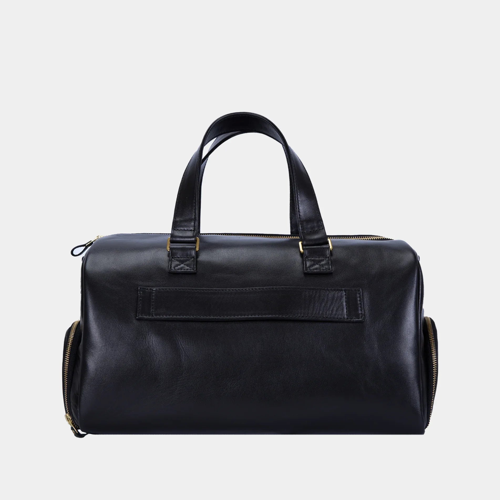 Side view of Nomad black leather duffel showing spacious zip side pocket for shoes or gym gear